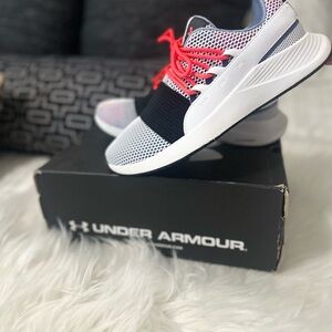 Under armor red black and pink running shoes.